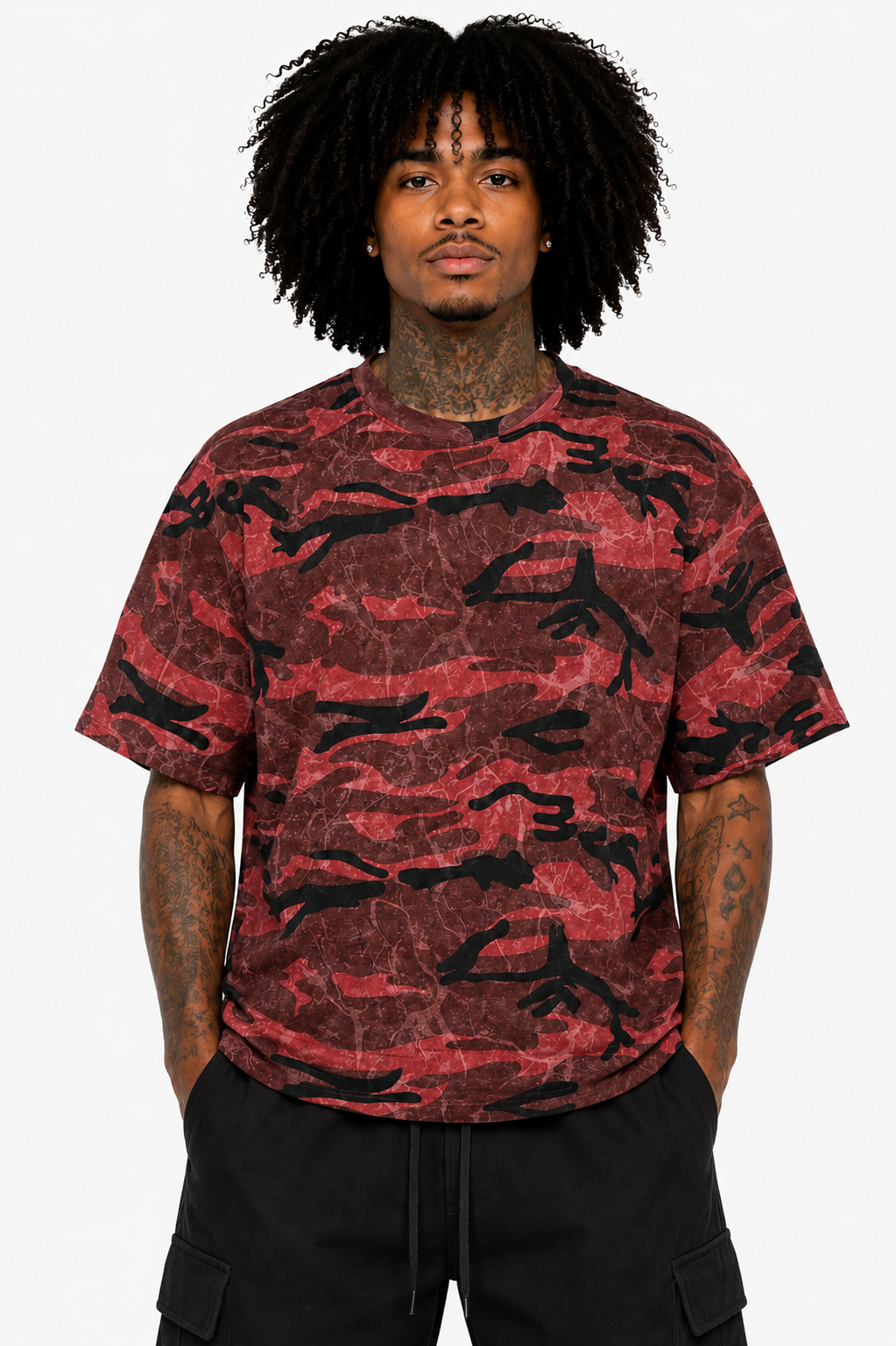 Person wearing a red and black camouflage t-shirt on a white background