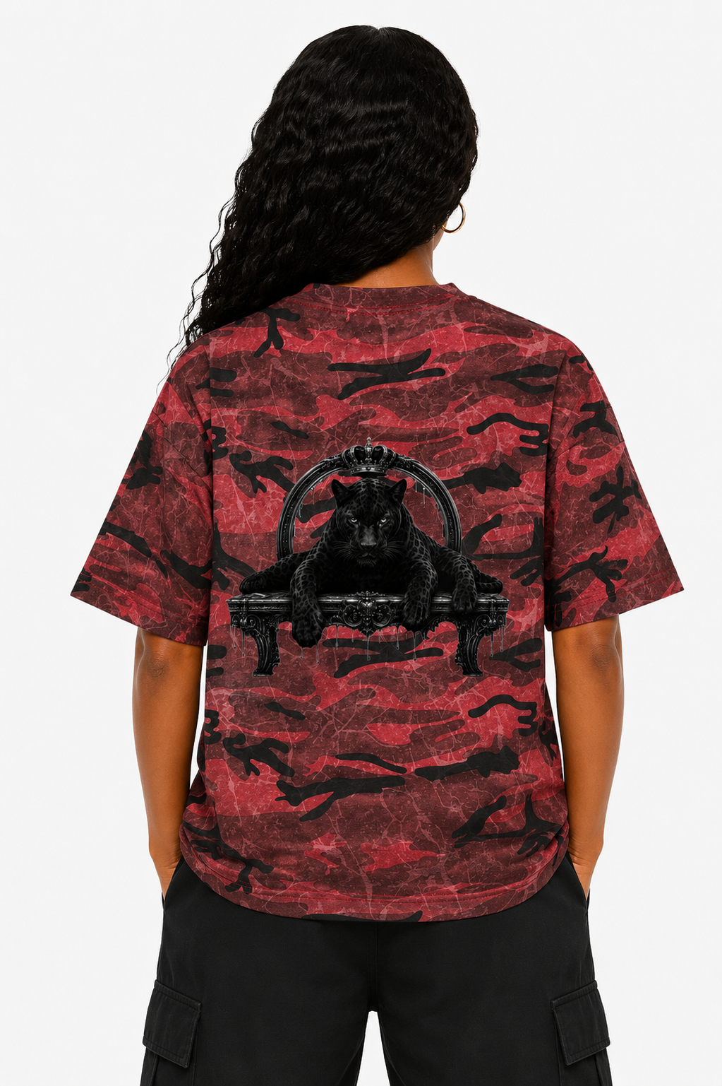 Person wearing a red camouflage t-shirt with a black graphic design on a white background