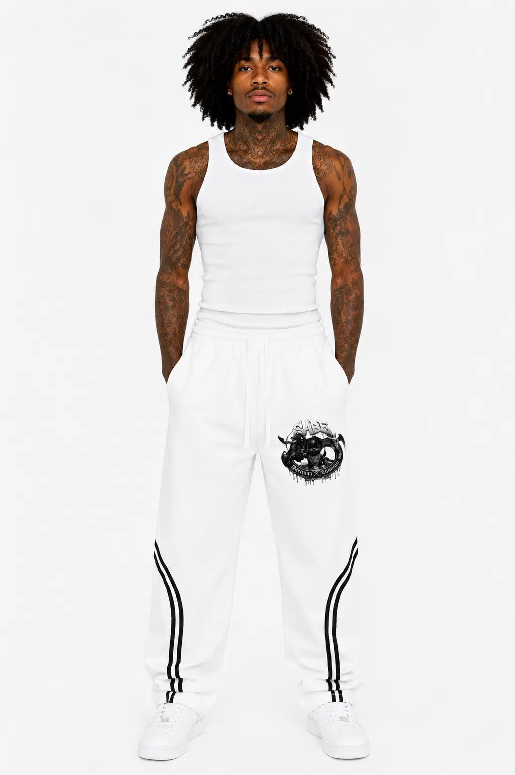 Person wearing a white tank top and pants with a black design on a white background