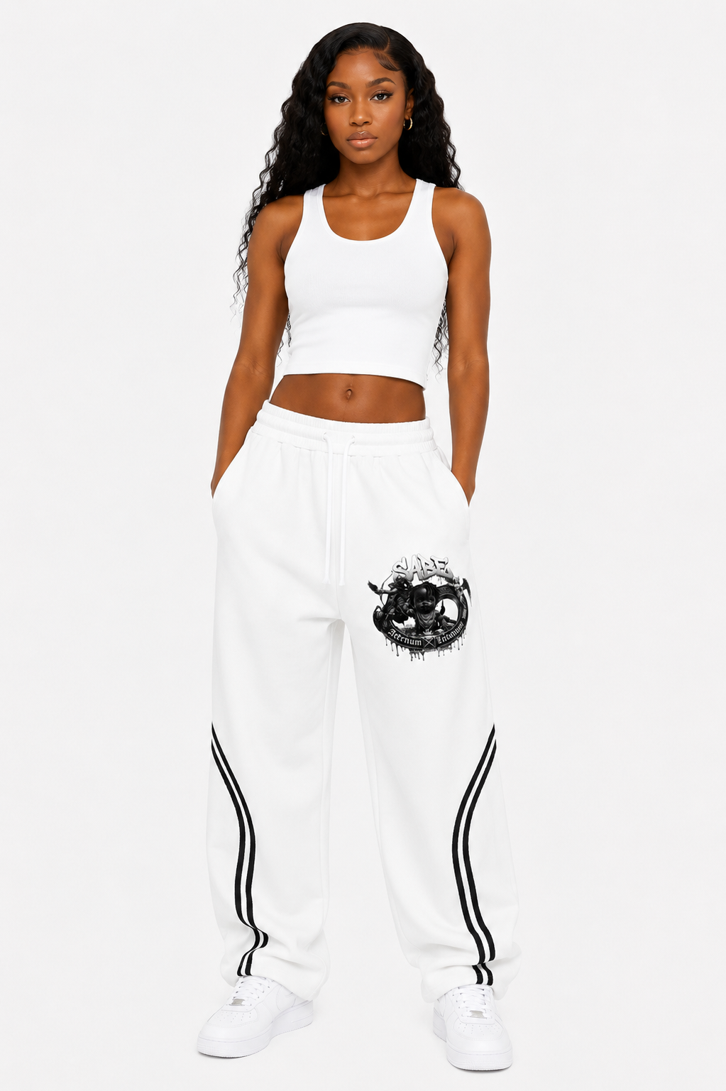 Woman wearing a white outfit with black designs on a white background