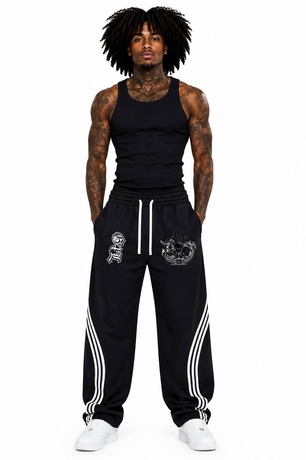 Man wearing black tank top and black pants with white stripes on a white background