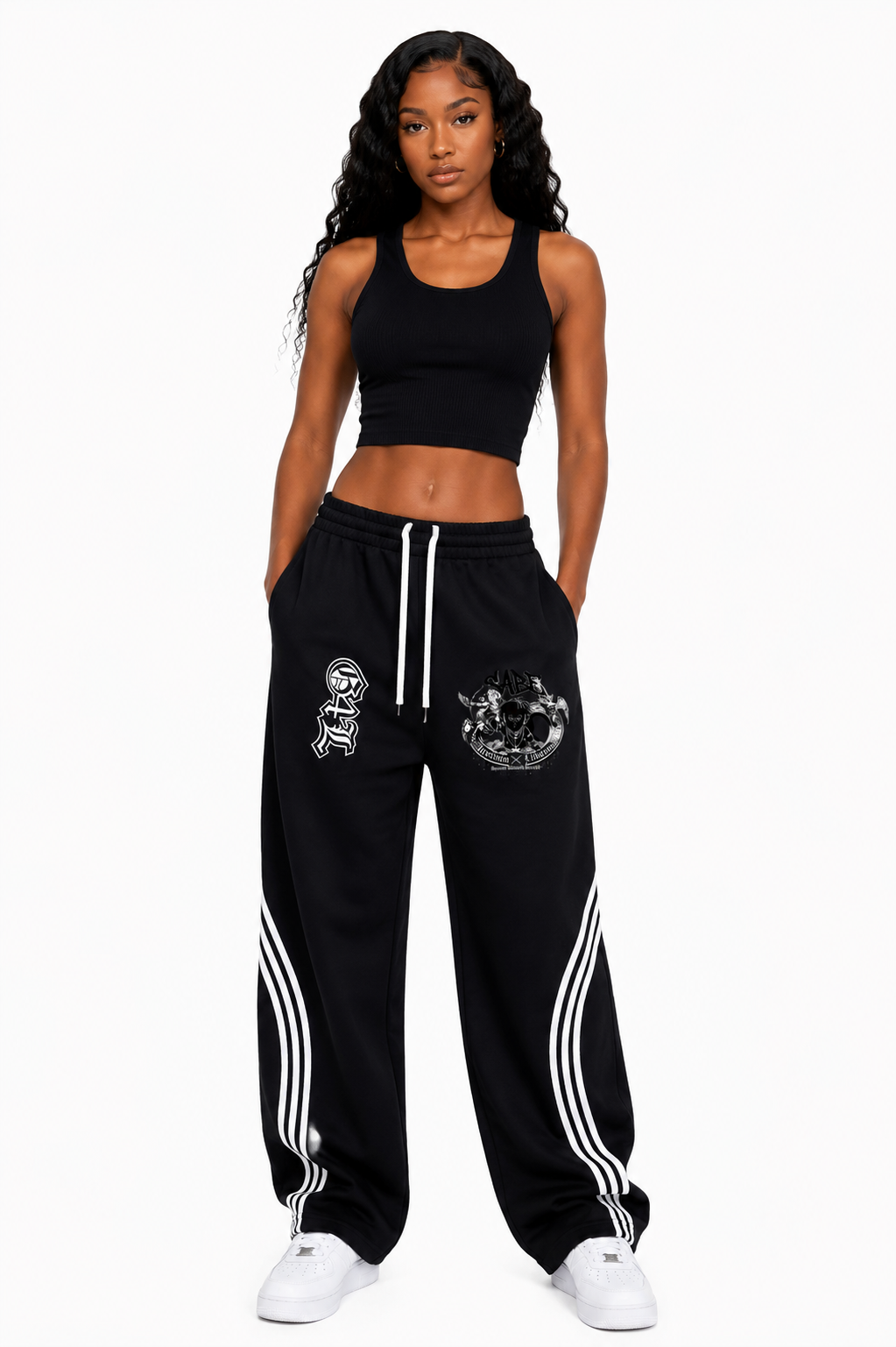 Woman wearing a black athletic outfit with white stripes on a white background