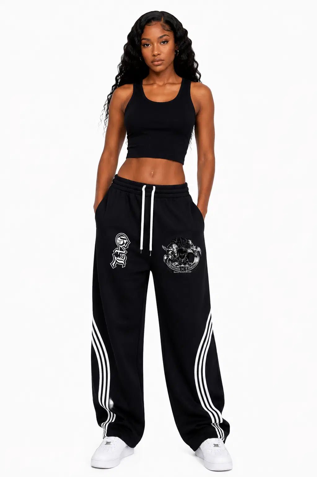 Woman wearing a black athletic outfit with white stripes on a white background