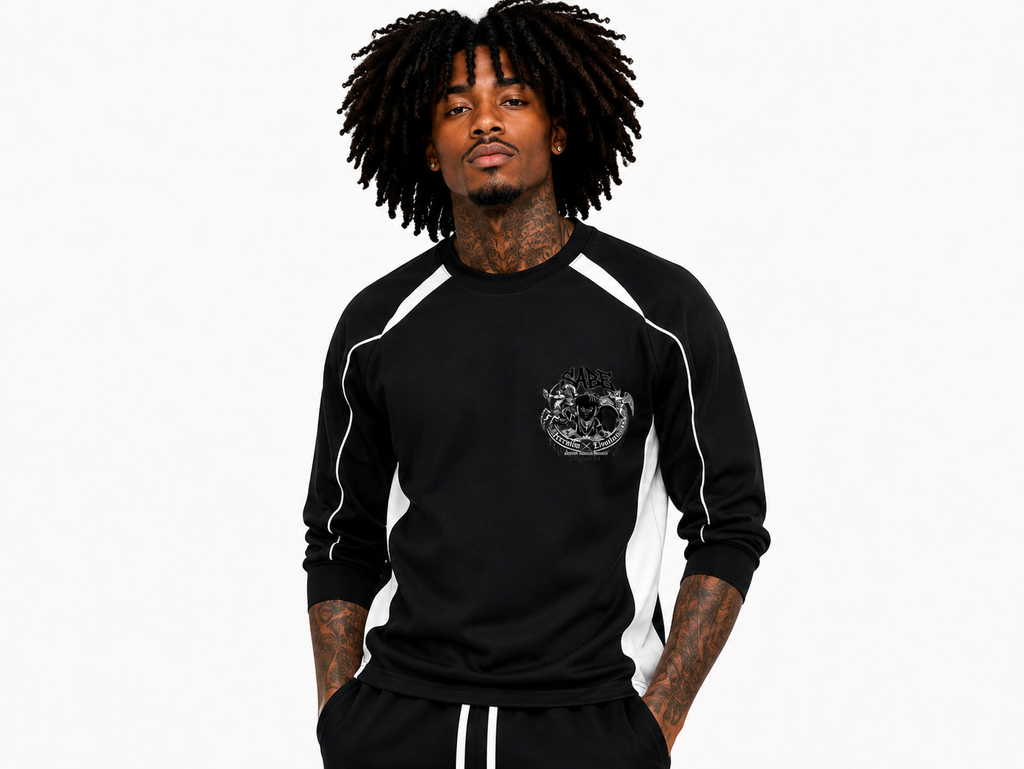 Person wearing a black long-sleeve shirt with white accents on a white background