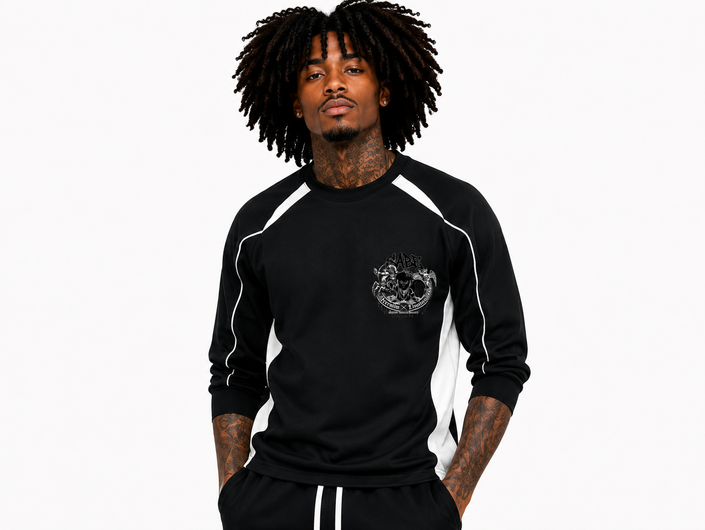 Person wearing a black long-sleeve shirt with white accents on a white background