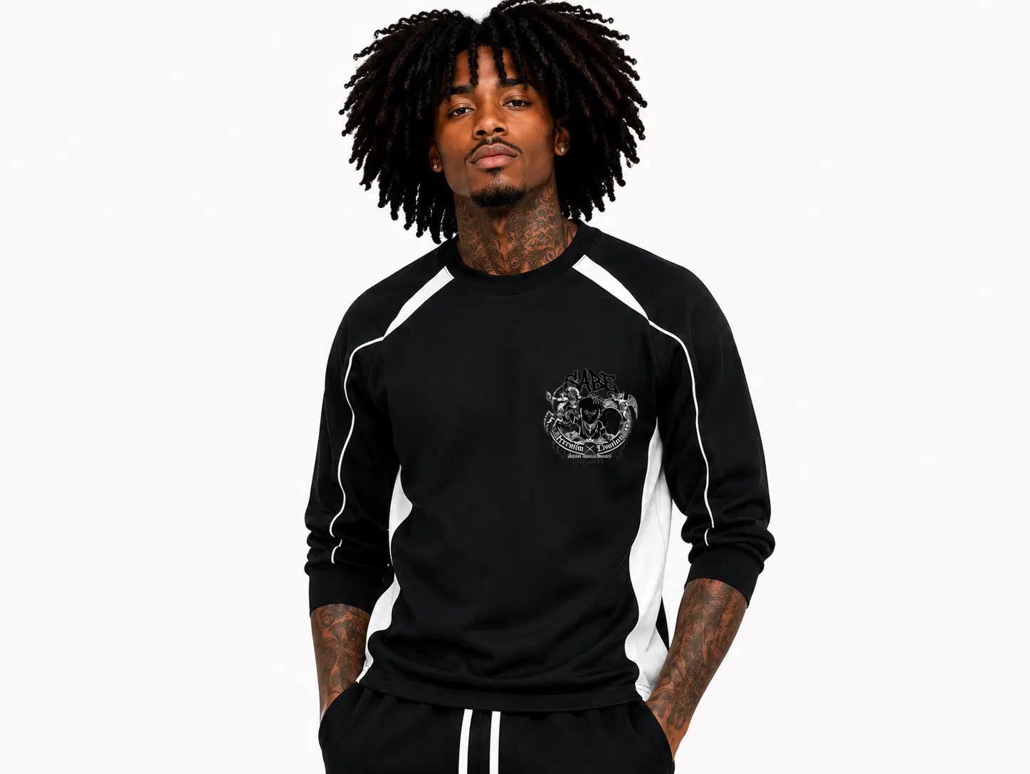Person wearing a black long-sleeve shirt with white accents on a white background