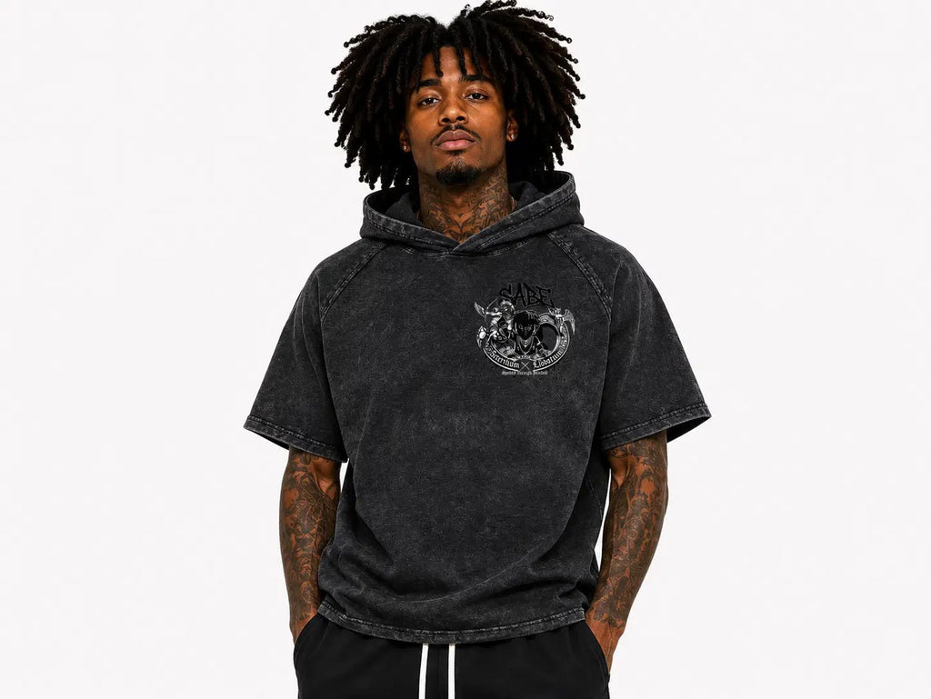 Man wearing a black hoodie with a logo on a white background