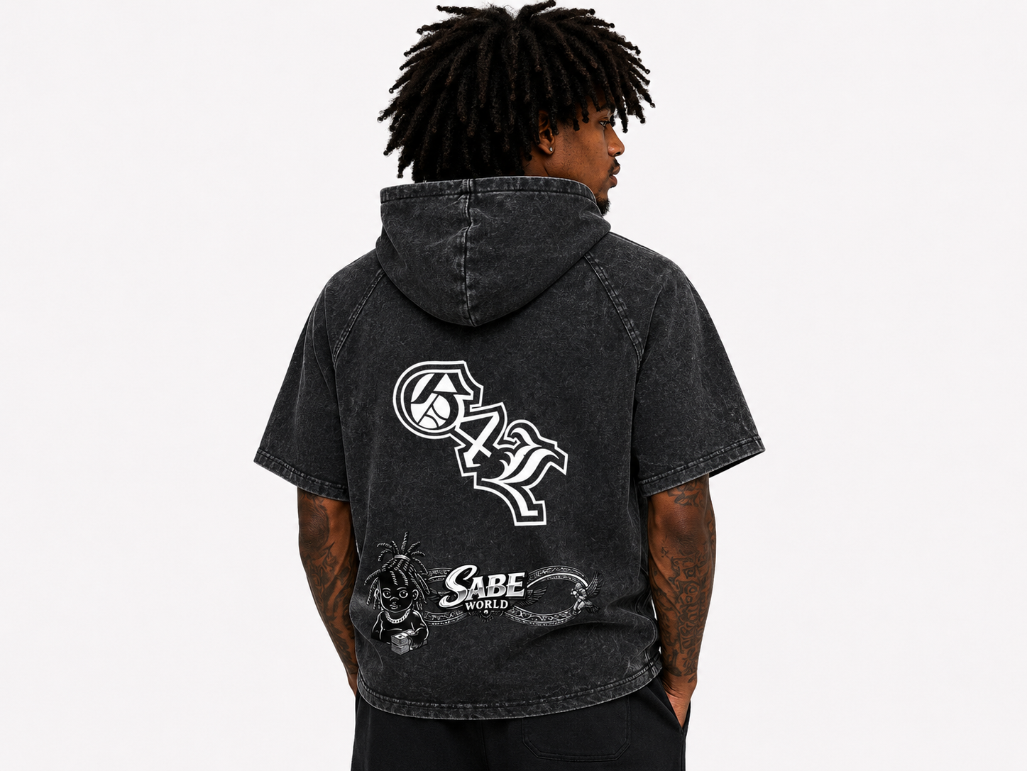 Person wearing a black hoodie with white graphics and text on the back, on a light gray background