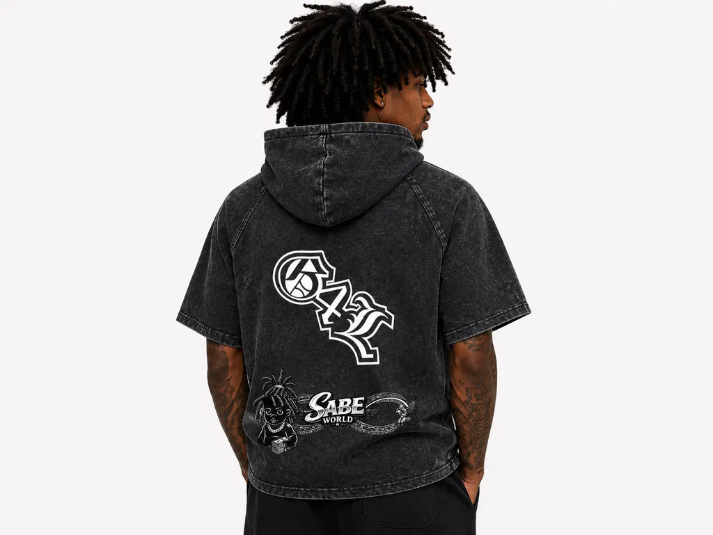 Person wearing a black hoodie with white graphics and text on the back, on a light gray background