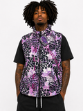 Person wearing a purple and black patterned vest over a black shirt on a white background