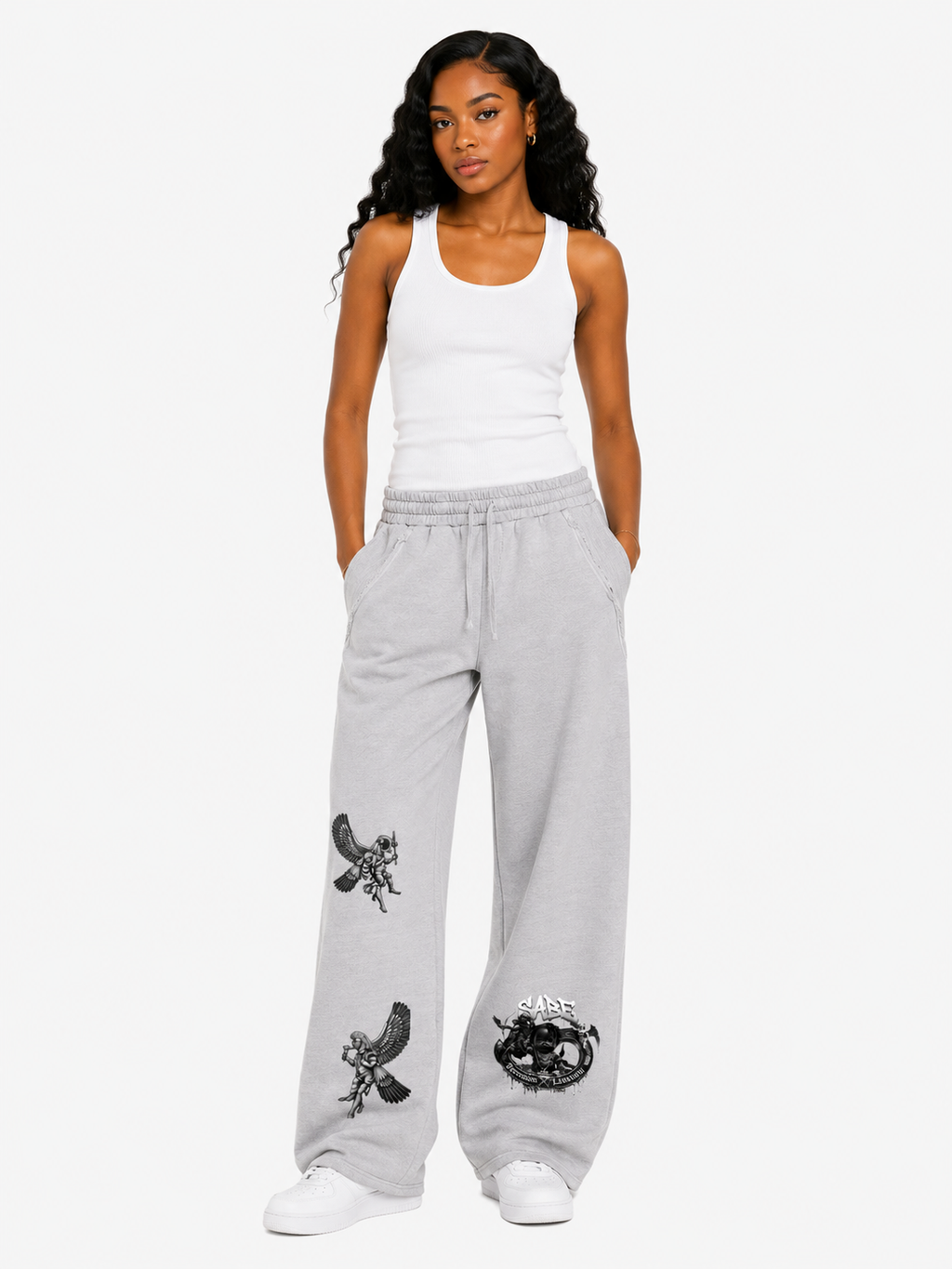 Woman wearing gray sweatpants with black graphics on a white background