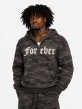 Person wearing a dark camouflage hoodie with 'For eber' text on a white background