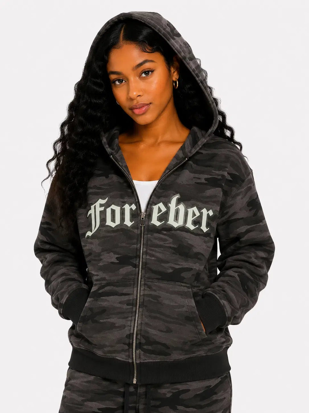 Person wearing a dark camouflage hoodie with 'Forever' text on a white background