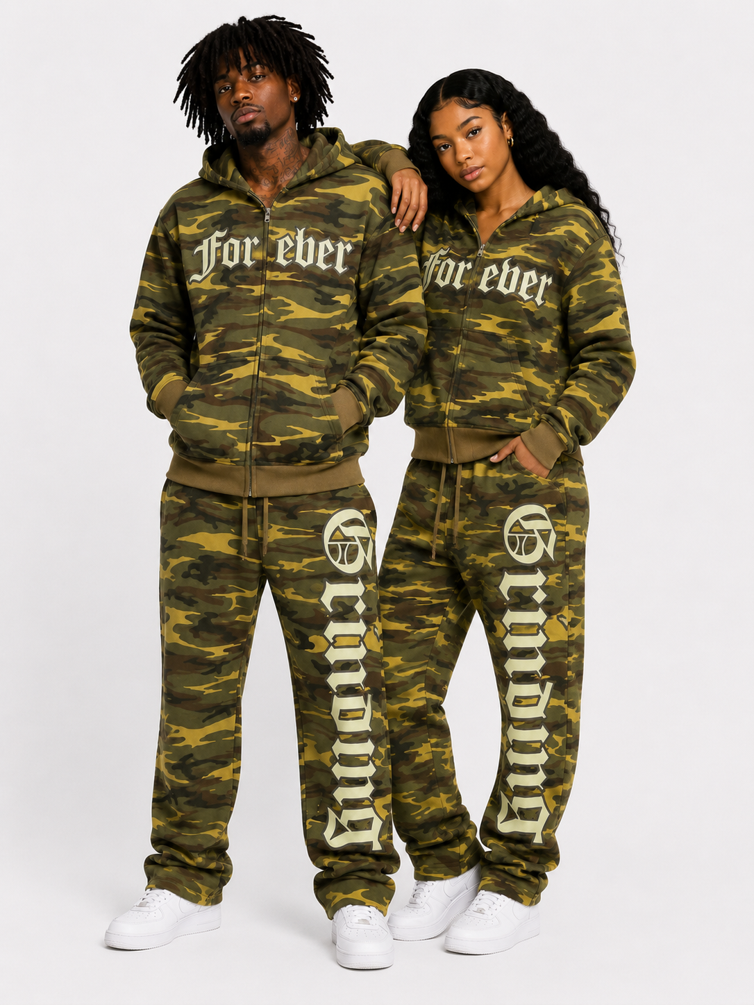 Two people wearing matching camouflage tracksuits with 'Forever' text on a white background