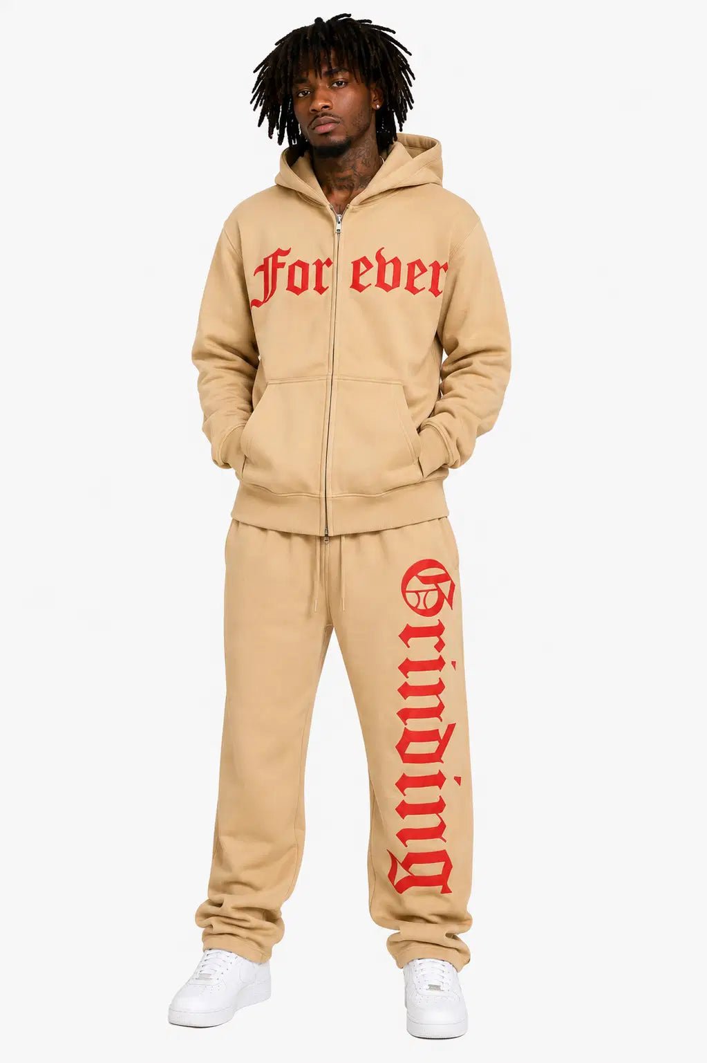 Person wearing a beige tracksuit with red text on a white background