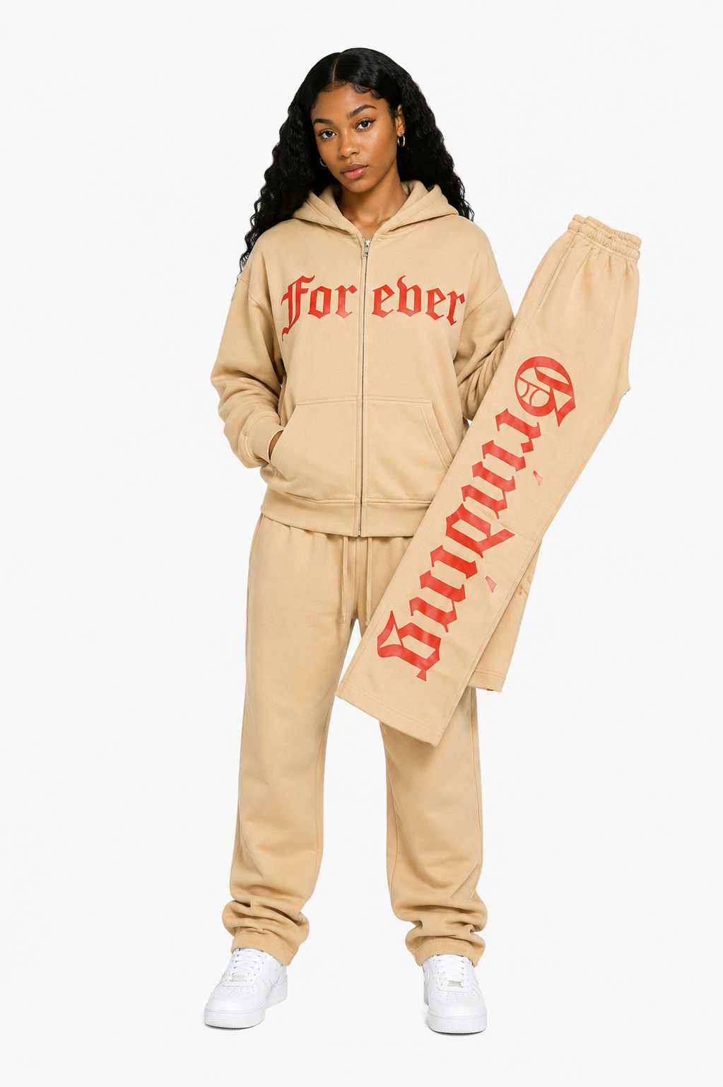 Person wearing a beige tracksuit with 'forever' text on a white background