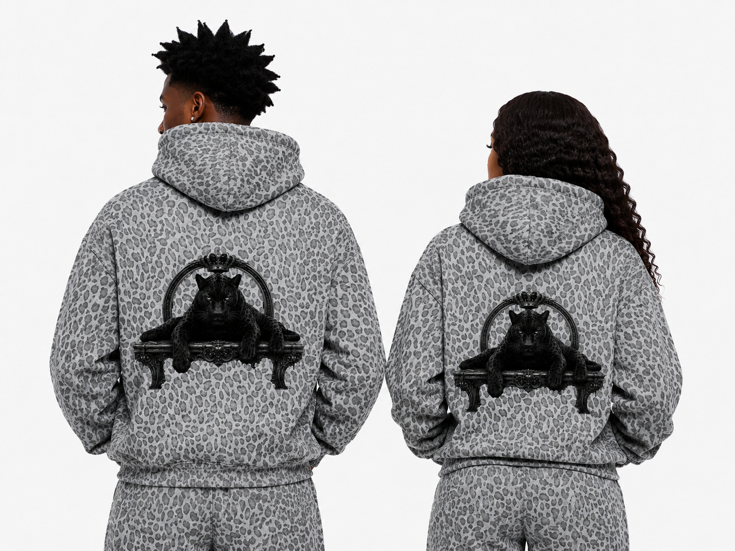 Two people wearing gray leopard print hoodies with a black panther design on the back.