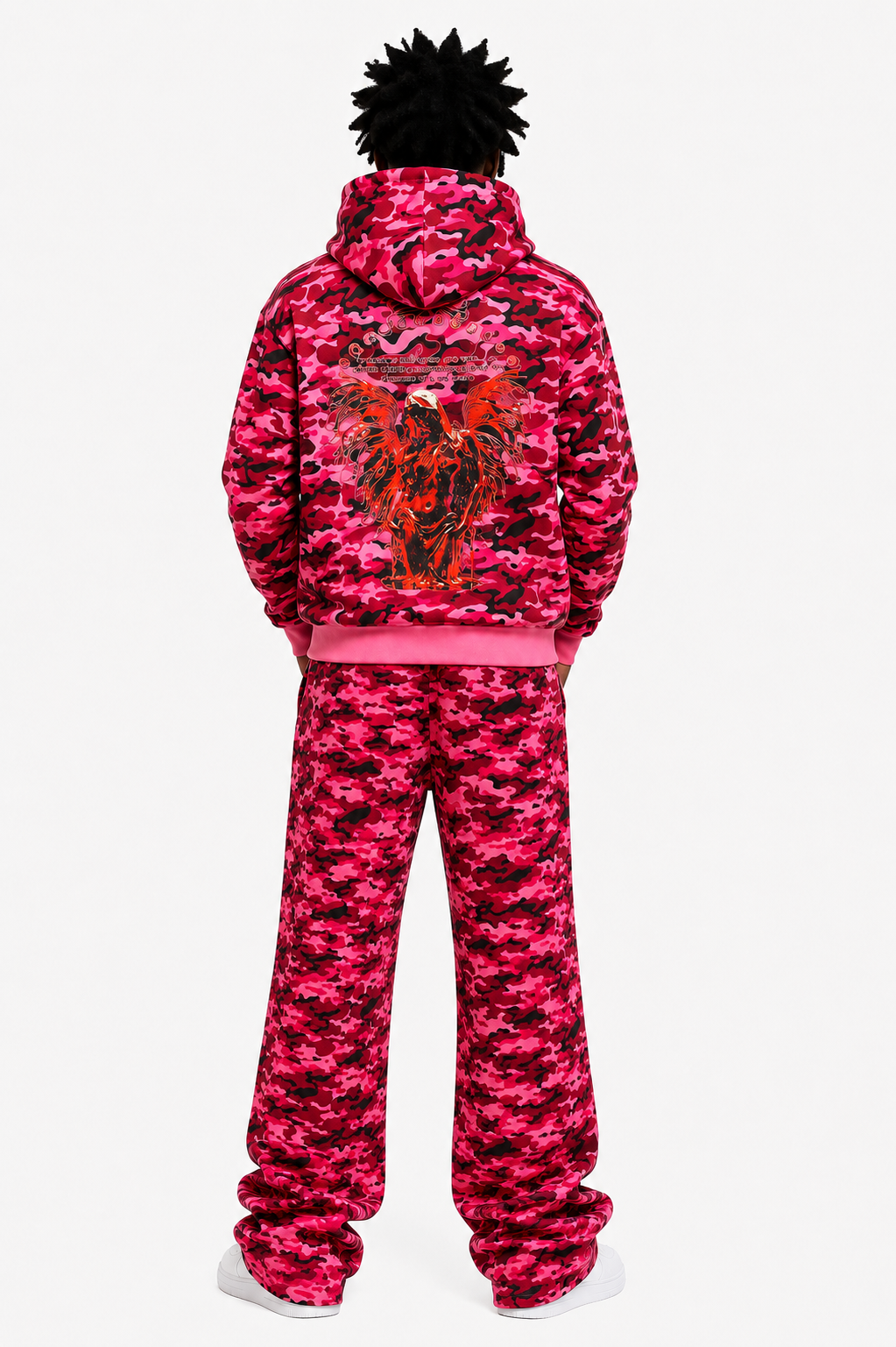 Person wearing a pink camouflage tracksuit with a logo on the back against a white background