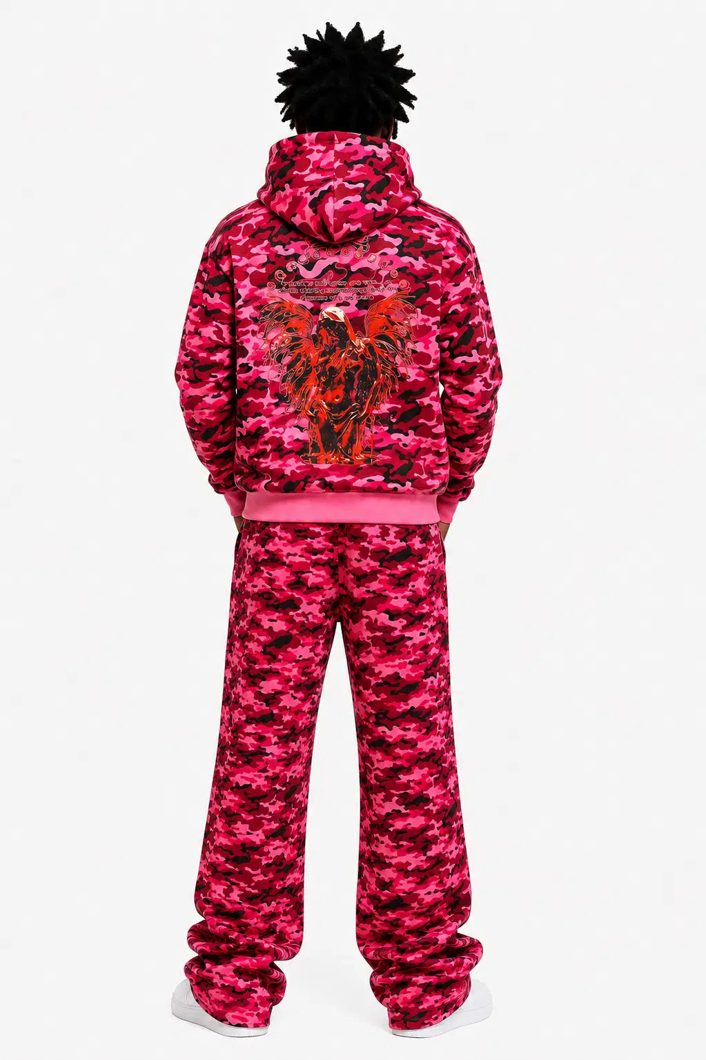 Person wearing a pink camouflage tracksuit with a logo on the back against a white background