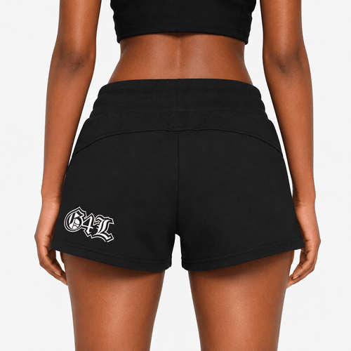 Black shorts with a logo on the back worn by a person against a plain background