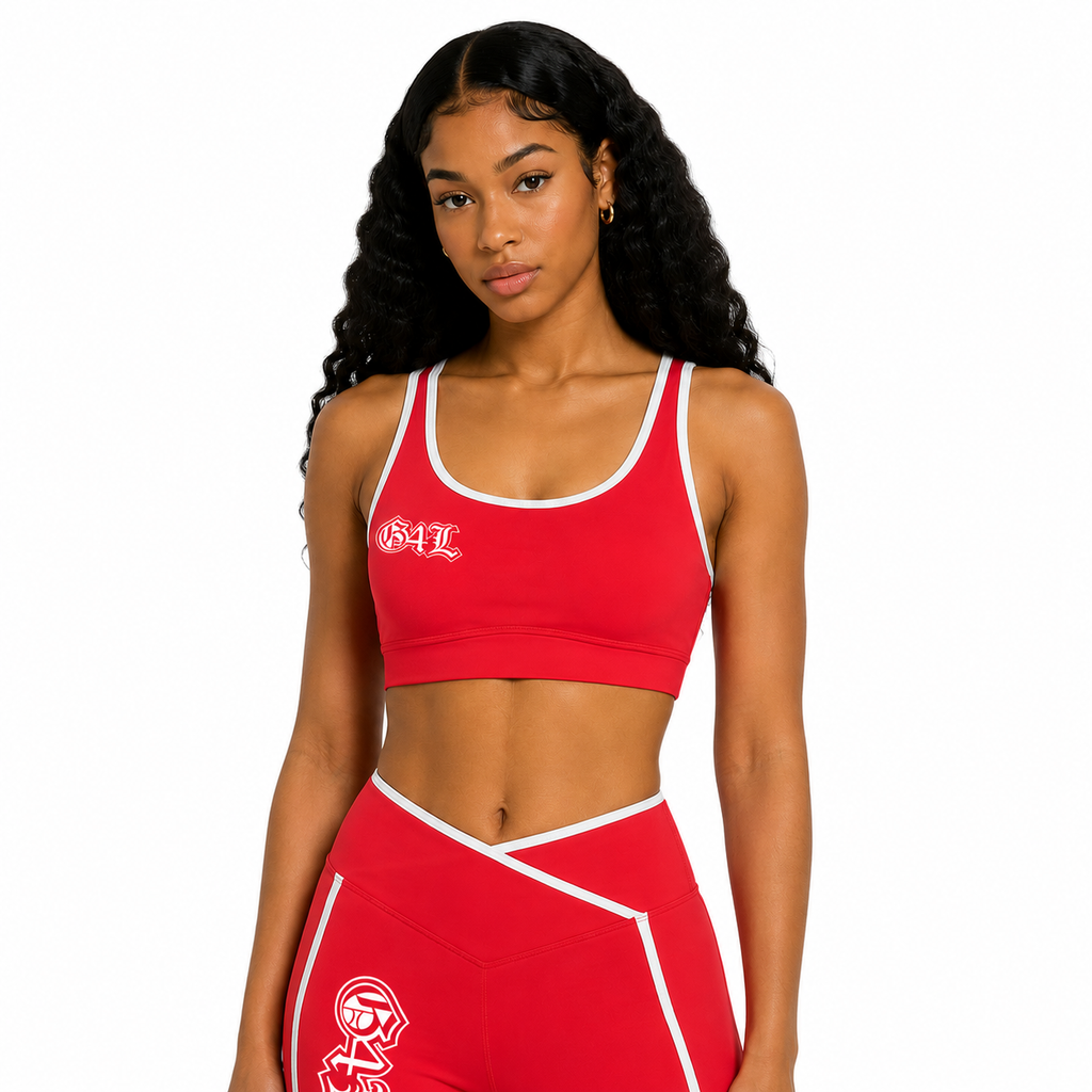Woman wearing a red sports bra and leggings with a logo on a white background