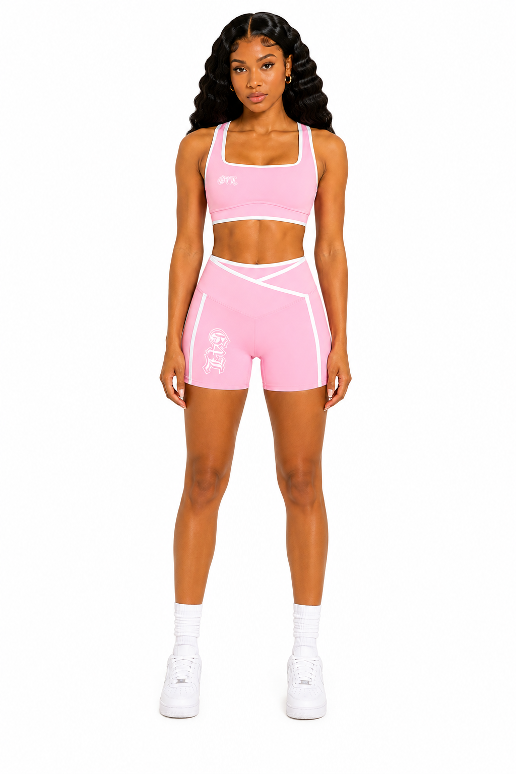 Woman wearing a pink athletic outfit on a white background
