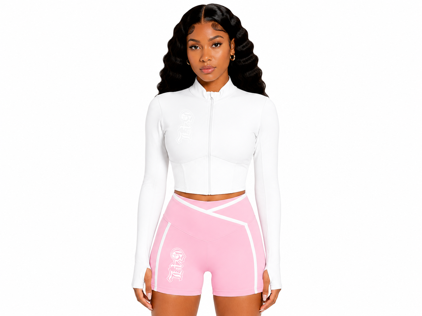 Woman wearing a white long-sleeve top and pink athletic shorts on a white background