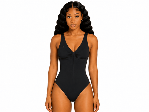 Woman wearing a black swimsuit on a white background