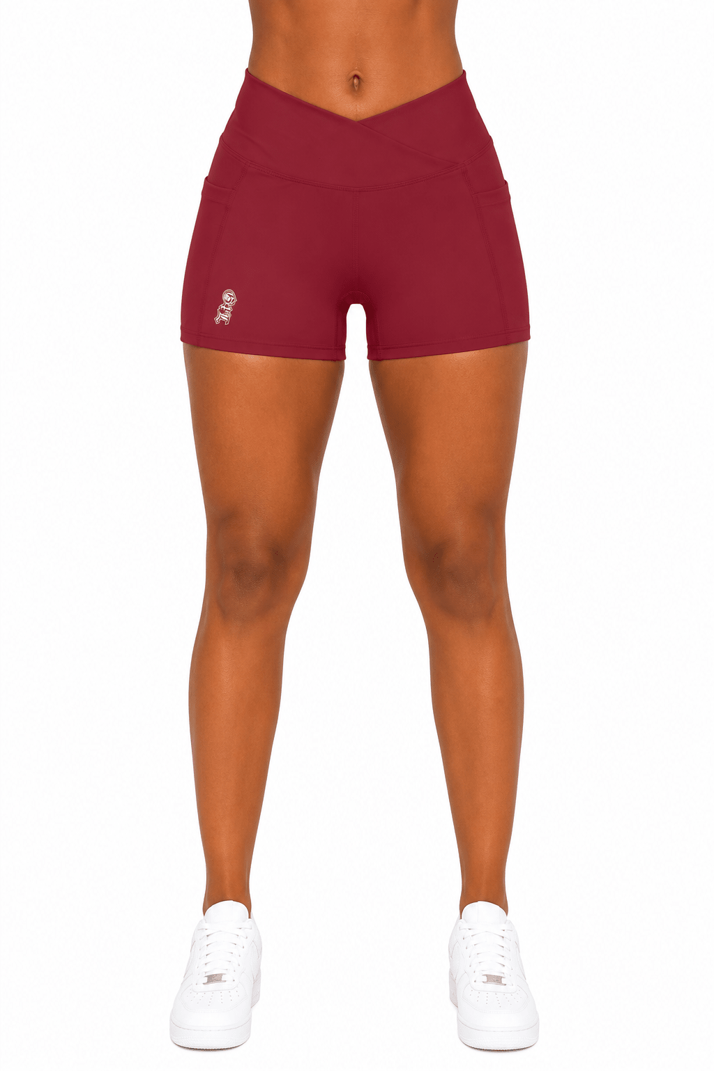 Maroon athletic shorts worn by a person on a white background