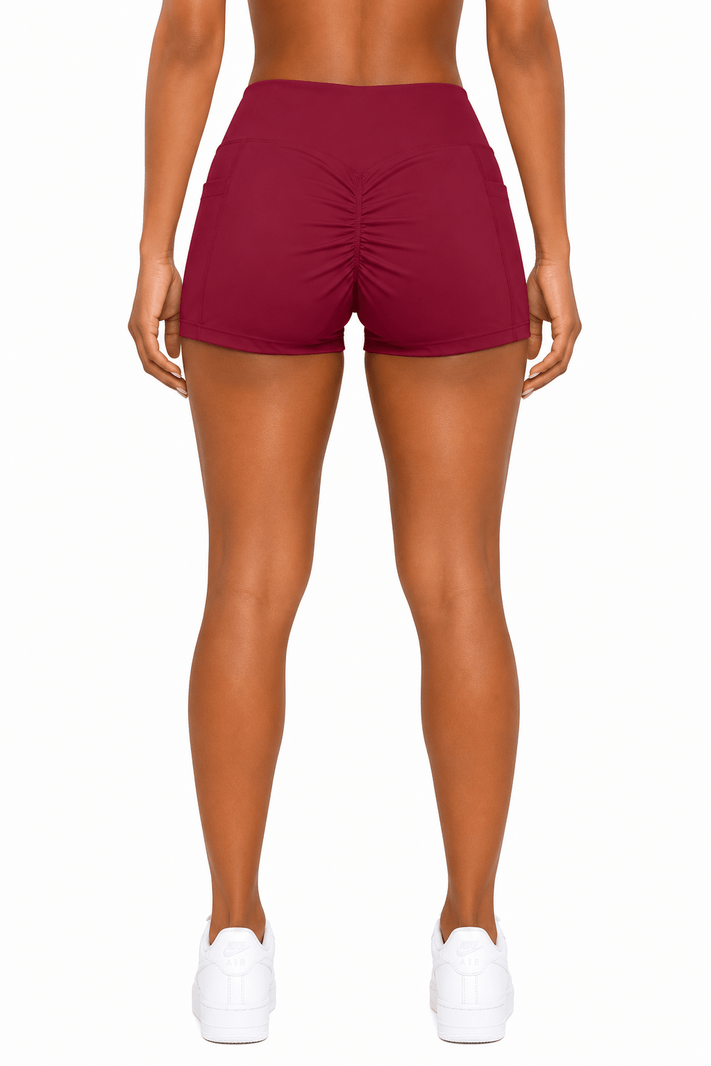 Maroon shorts worn by a person on a white background