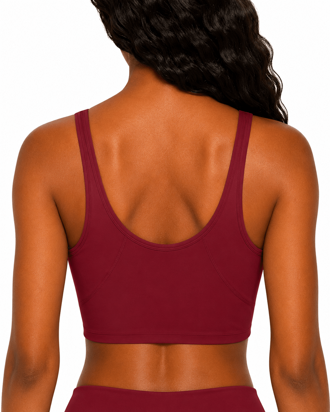 Maroon sports bra worn by a person on a white background