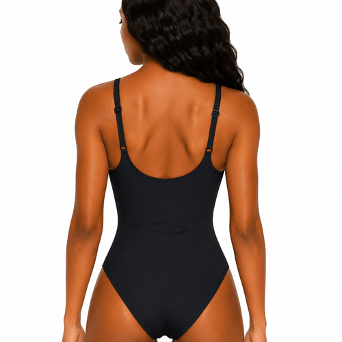 Black swimsuit worn by a model on a white background