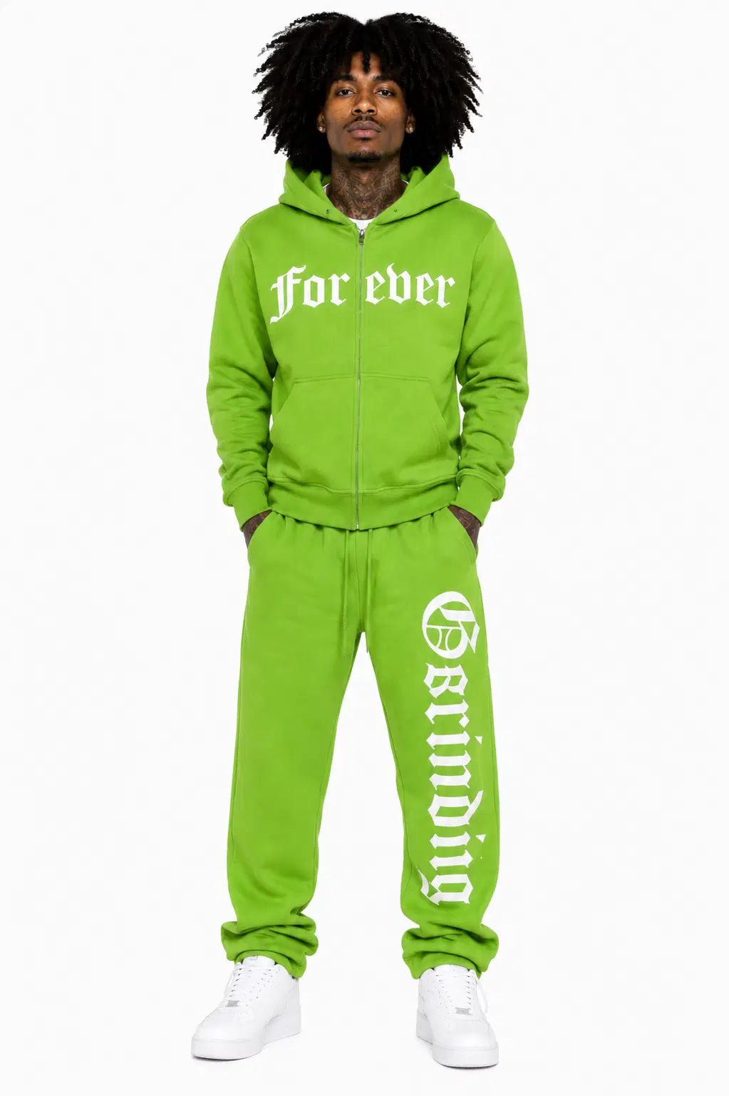 Person wearing a bright green 'for ever' tracksuit on a white background