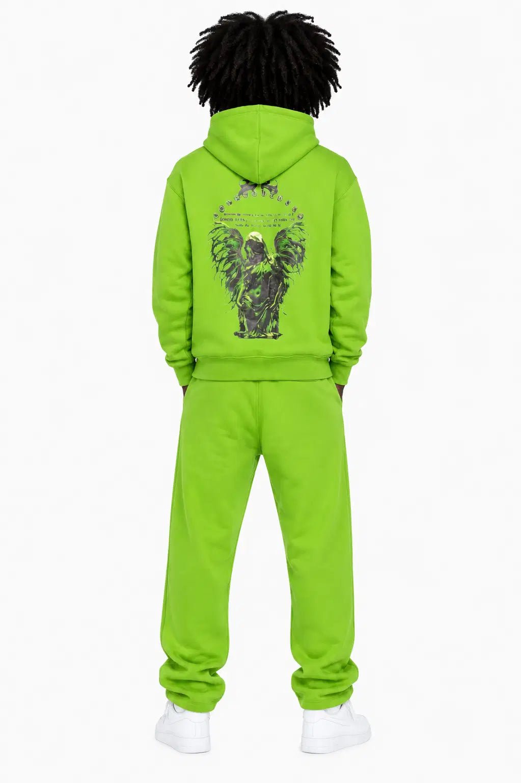 Person wearing a bright green tracksuit with a design on the back, standing against a white background