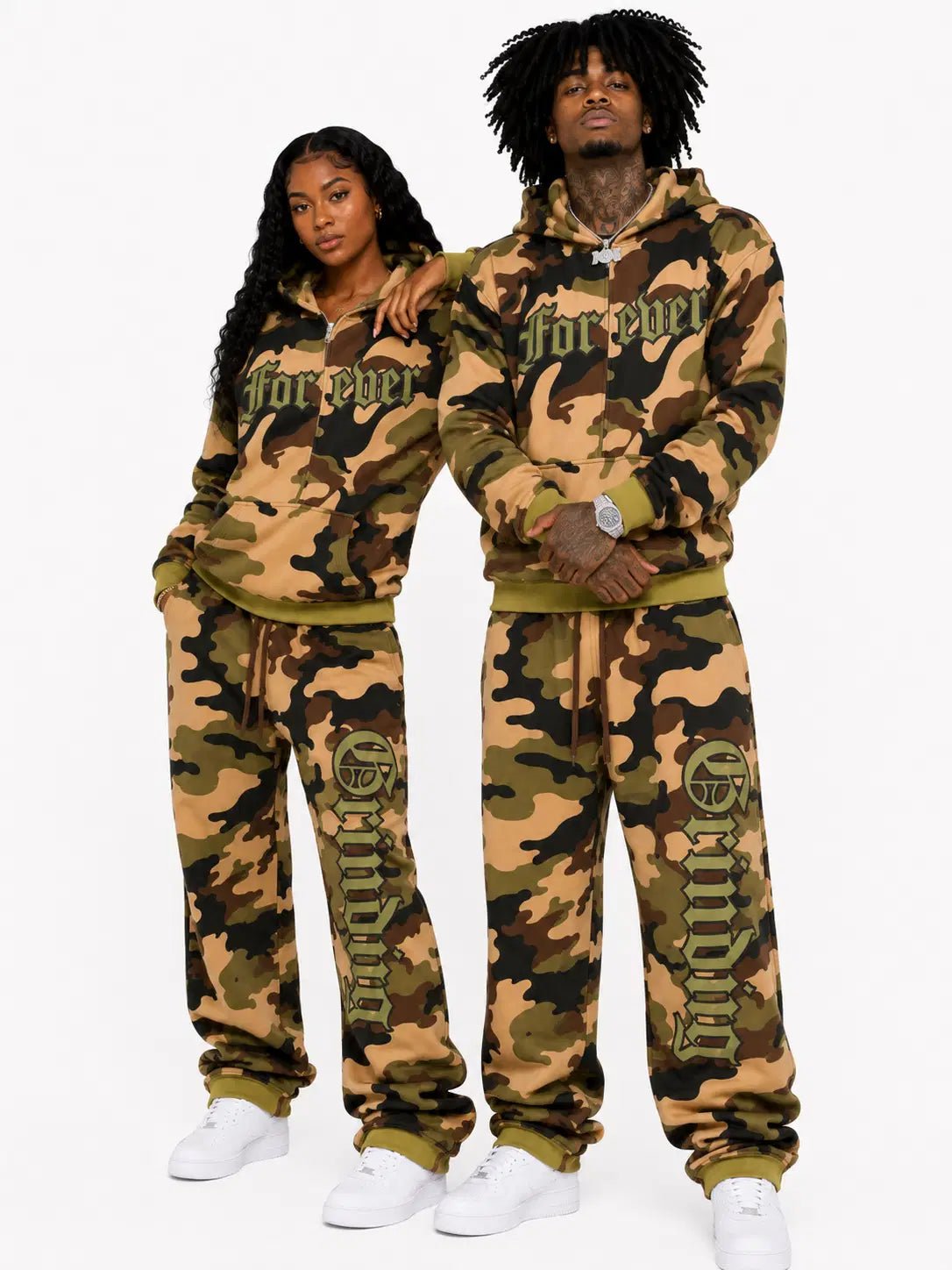 Two people wearing matching camouflage tracksuits with 'Forever' text on a white background