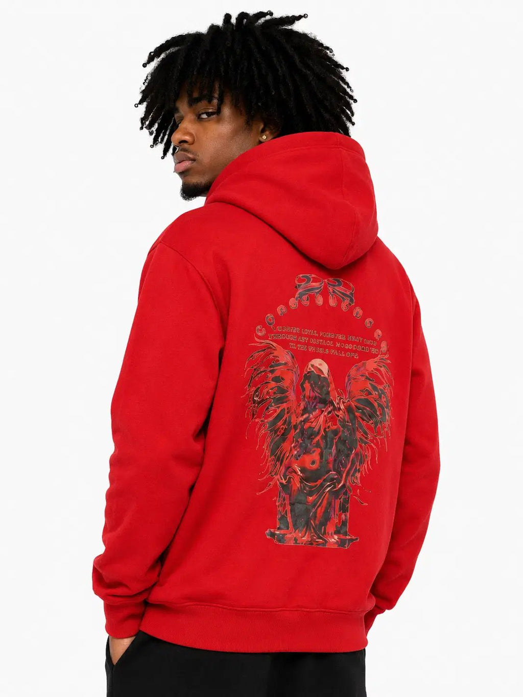 Person wearing a red hoodie with a graphic design on the back, standing against a white background