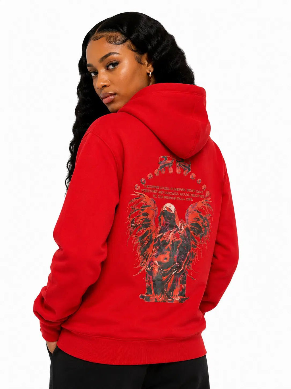 Person wearing a red hoodie with a graphic design on the back, standing against a white background