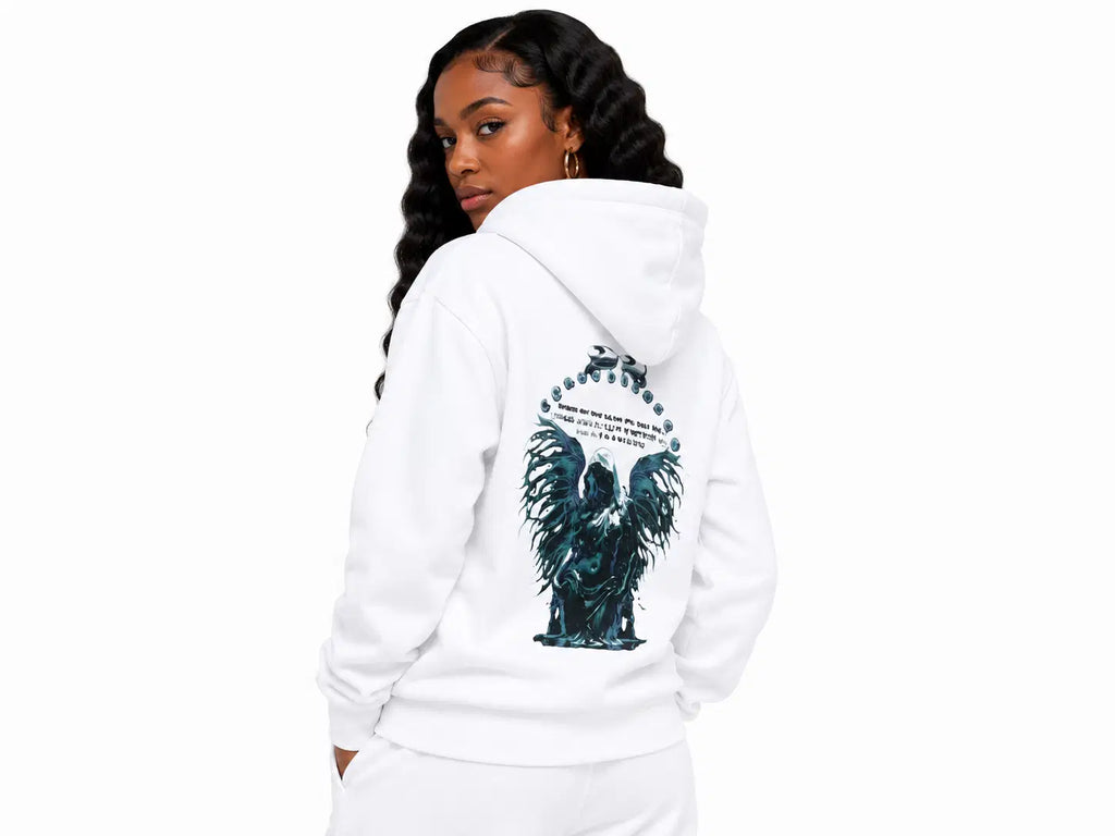 Woman wearing a white hoodie with an eagle design on the back against a white background
