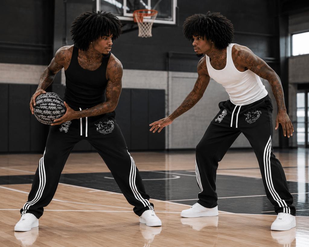 Two men playing basketball on an indoor court