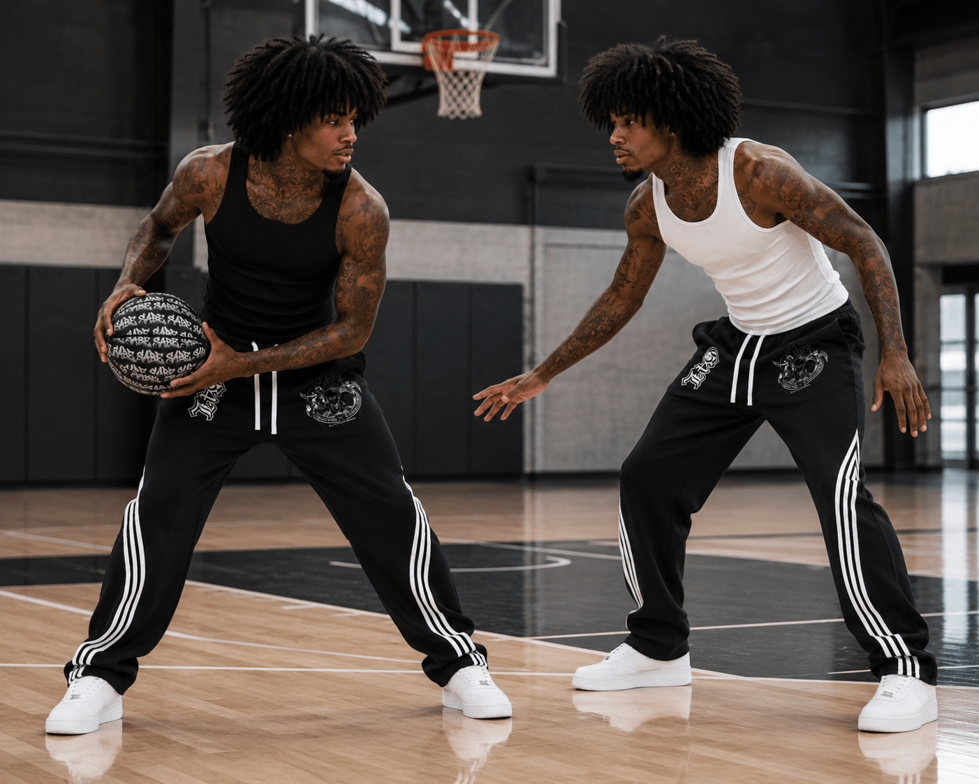 Two men playing basketball on an indoor court