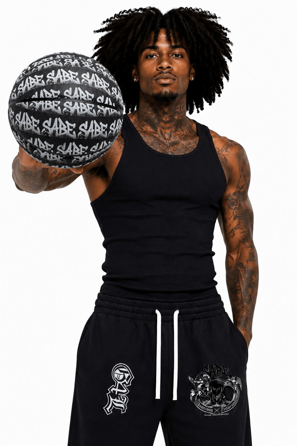 Man holding a black and white basketball with 'Sabo' branding, wearing matching black athletic wear.