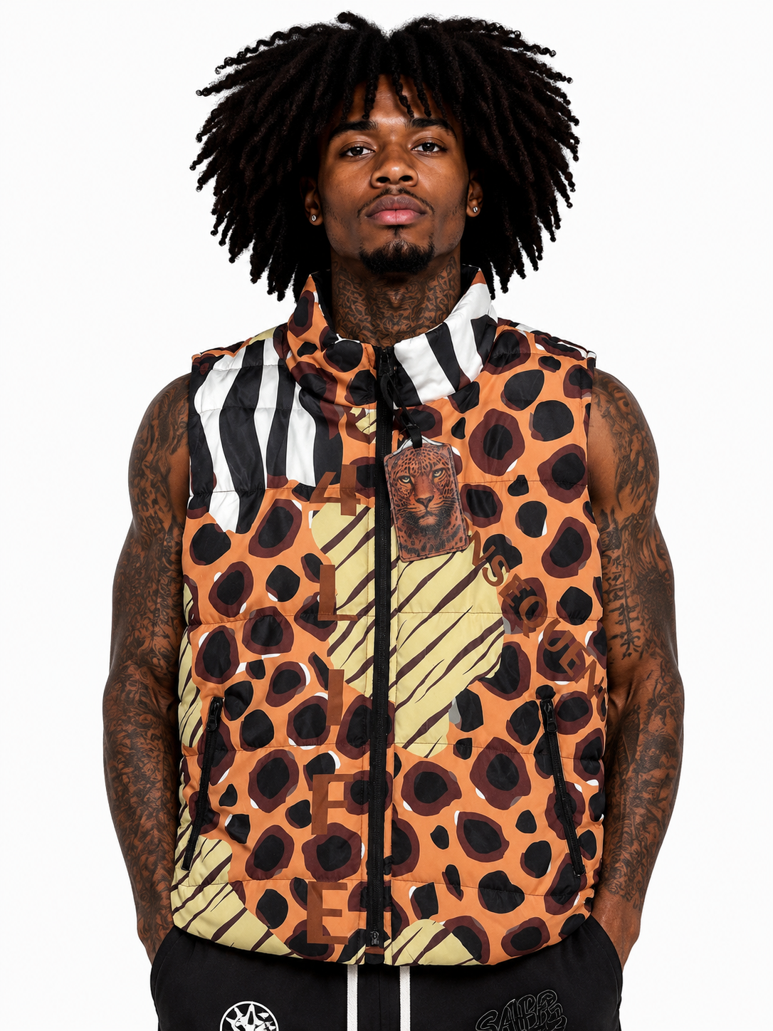 Person wearing a sleeveless jacket with a leopard print pattern on a white background