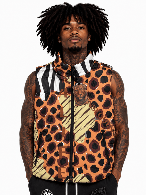 Person wearing a sleeveless jacket with a leopard print pattern on a white background
