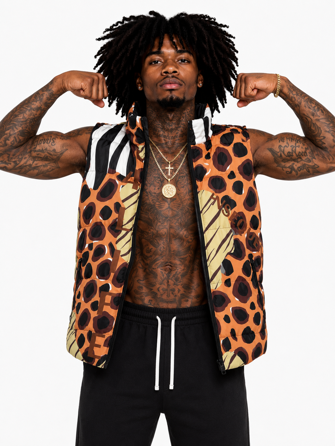 Man flexing muscles wearing a patterned vest on a white background