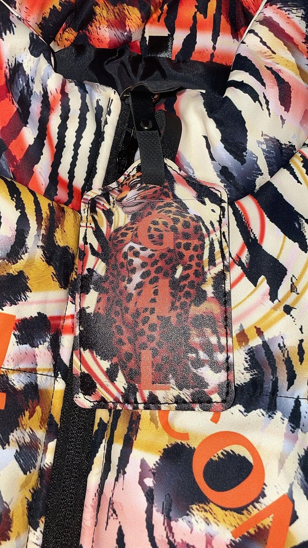 Close-up of a colorful jacket with a leopard print pocket.